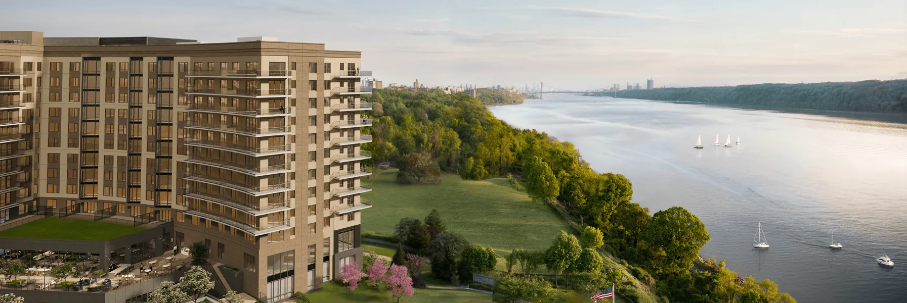 River's Edge building and Hudson River waterfront with sailboats